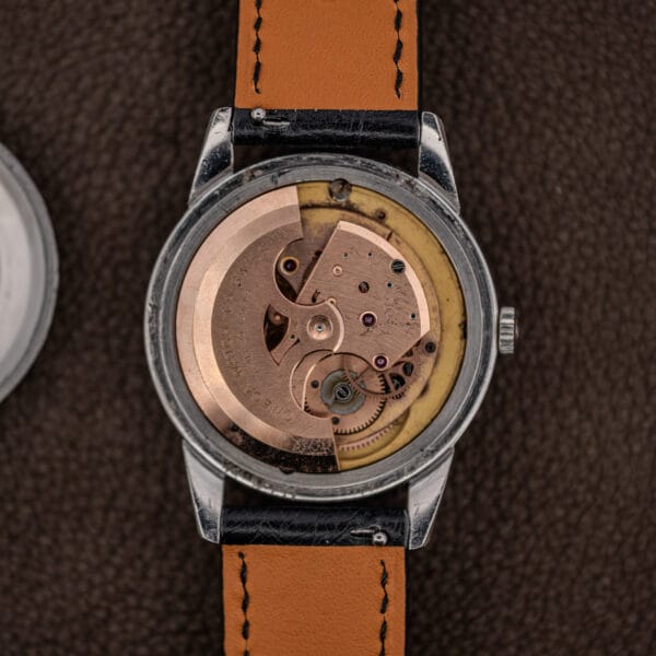 Omega caliber 503 full rotor engraved OMEGA WATCH CO SWISS, seen in the case with caseback removed