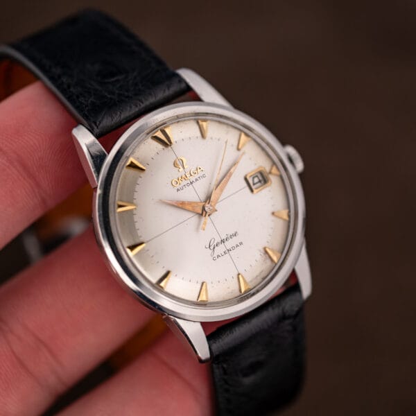 Omega 2982-3 SC held in hand showing the modest 34mm case size and aged cream crosshair dial