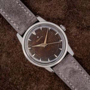 Zenith Cal. 120 browned tropic dial with applied baton markers and dauphine hands on anthracite suede strap