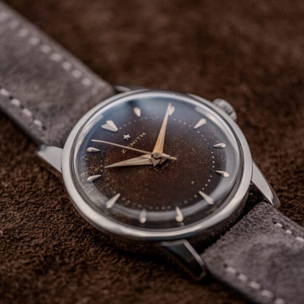 Zenith Cal. 120 three-quarter view showing uneven dial browning, downturned lugs and anthracite Italian suede strap