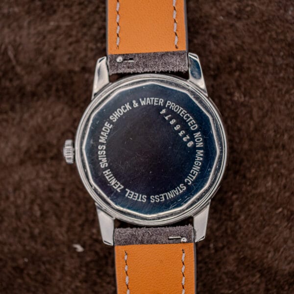 Zenith twelve-sided stainless caseback engraved SHOCK & WATER PROTECTED NON MAGNETIC STAINLESS STEEL with hairline wear