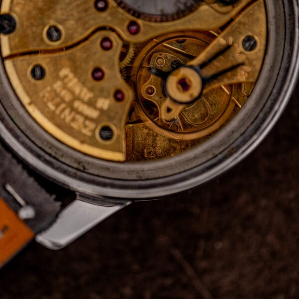 Zenith caliber 120 stamp on the tarnished gilt plate below the balance wheel and gilt balance cock