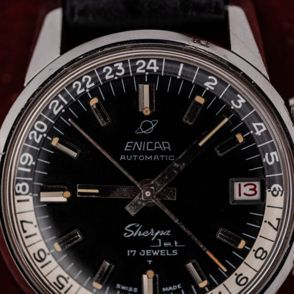 Printed 24-hour ring numerals and aged cream tritium plots on a vintage Enicar Sherpa Jet dial