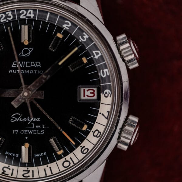 Twin knurled compressor crowns at two and four o'clock on the Enicar Sherpa Jet steel case