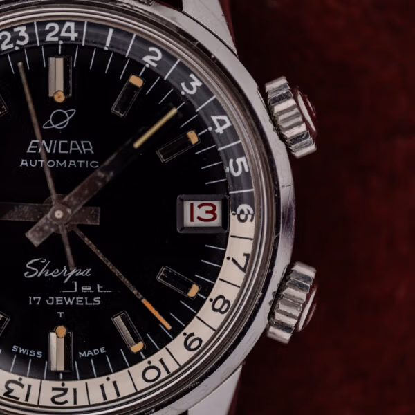 Twin knurled compressor crowns at two and four o'clock on the Enicar Sherpa Jet steel case
