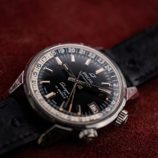 Angled view of the Enicar Sherpa Jet steel case with its tall domed crystal and both crowns