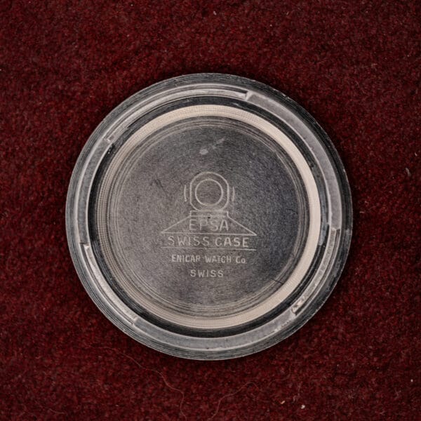 Interior of the Enicar caseback stamped with the EPSA Swiss Case diving helmet mark and Enicar Watch Co