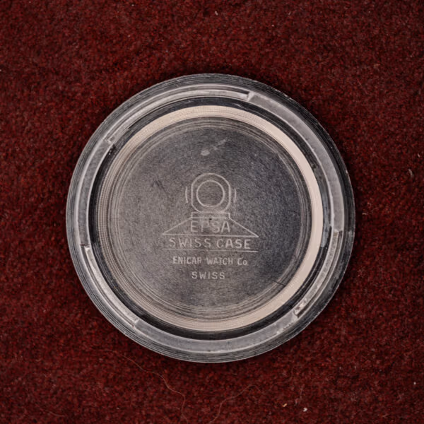Interior of the Enicar caseback stamped with the EPSA Swiss Case diving helmet mark and Enicar Watch Co