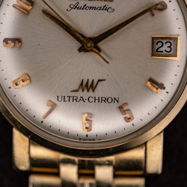 Lower dial of the Longines Ultra-Chron with winged hourglass logo, ULTRA-CHRON signature and SWISS at the dial base