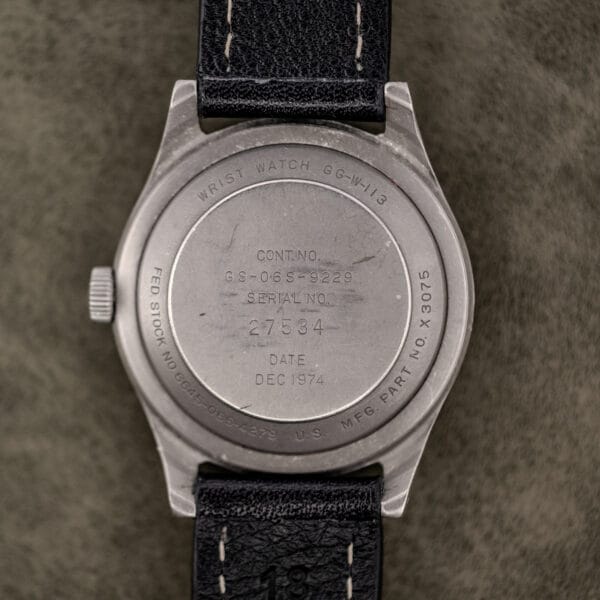 Benrus GG-W-113 caseback engraved WRIST WATCH GG-W-113, contract GS-06S-9229, serial 27534 and date DEC 1974