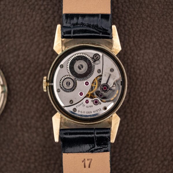 Elgin caliber 680 manual wind movement in its case, bridge stamped ELGIN 680 U-S-A and 21 JEWELS