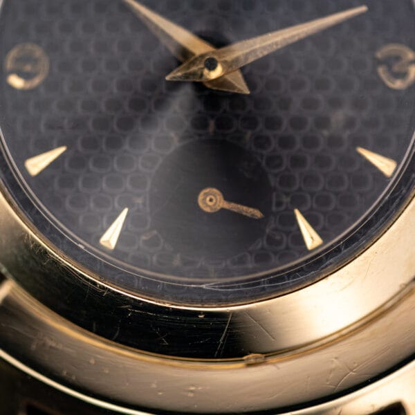 Black Knight lower dial with plain sunken sub-seconds register at six and applied gold dagger hour markers