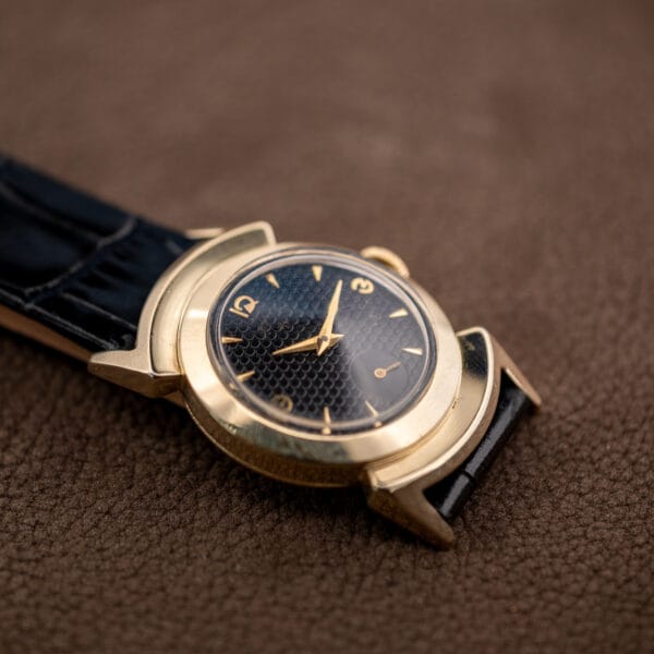 Lord Elgin Black Knight from the lug end, black alligator-grain strap with pale contrast stitching