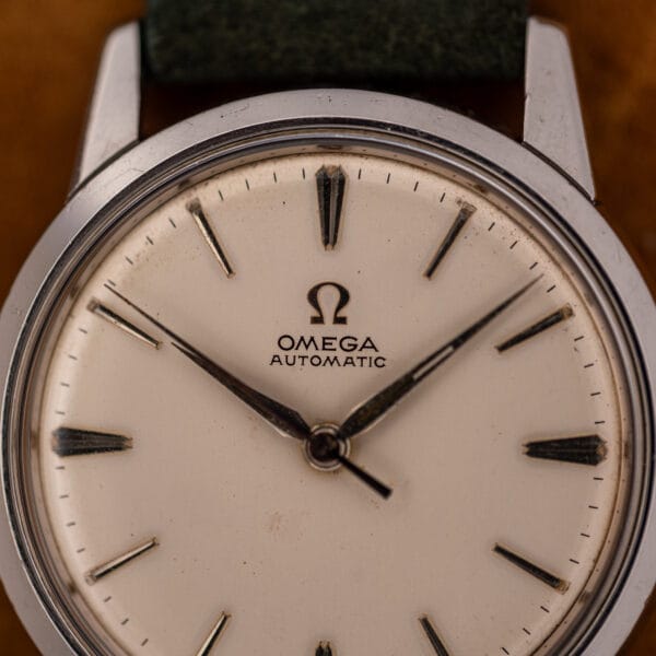 Omega 14773-1 dial macro showing OMEGA AUTOMATIC signature, applied baton markers and aged specks around the indices