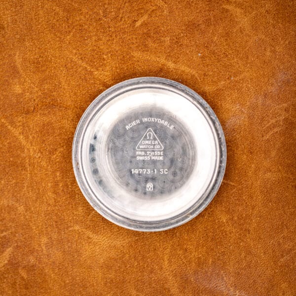 Omega 14773-1 inner caseback stamped ACIER INOXYDABLE, FAB. SUISSE and 14773-1 SC over circular perlage