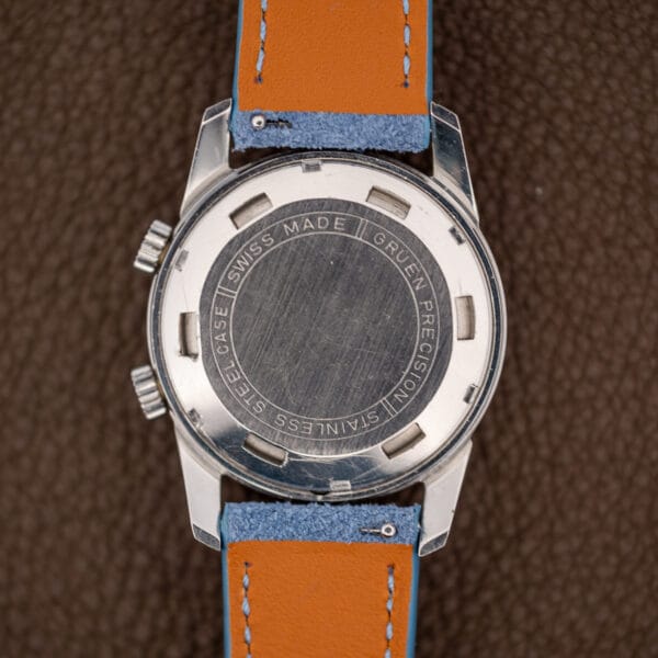 Gruen caseback engraved SWISS MADE GRUEN PRECISION STAINLESS STEEL CASE, showing honest surface scratching