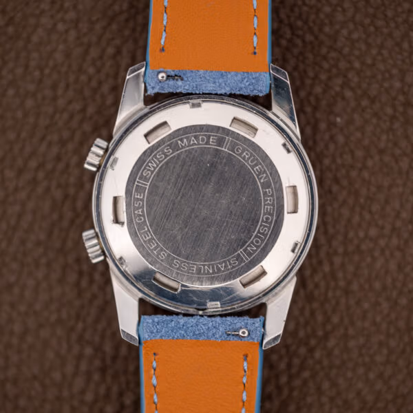 Gruen caseback engraved SWISS MADE GRUEN PRECISION STAINLESS STEEL CASE, showing honest surface scratching