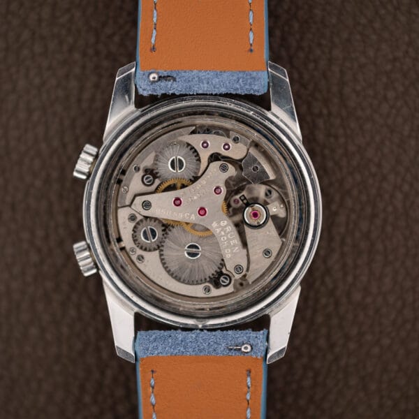 Gruen alarm movement inside the open steel case, seventeen jewels, brushed bridges and bright screw heads