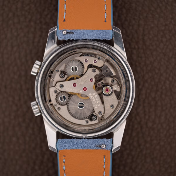 Gruen alarm movement inside the open steel case, seventeen jewels, brushed bridges and bright screw heads