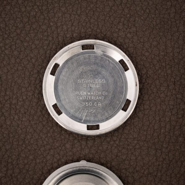 Gruen caseback interior stamped 950 CA, GRUEN WATCH Co, SWITZERLAND and STAINLESS STEEL over machining marks