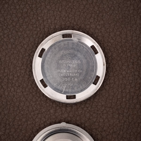 Gruen caseback interior stamped 950 CA, GRUEN WATCH Co, SWITZERLAND and STAINLESS STEEL over machining marks