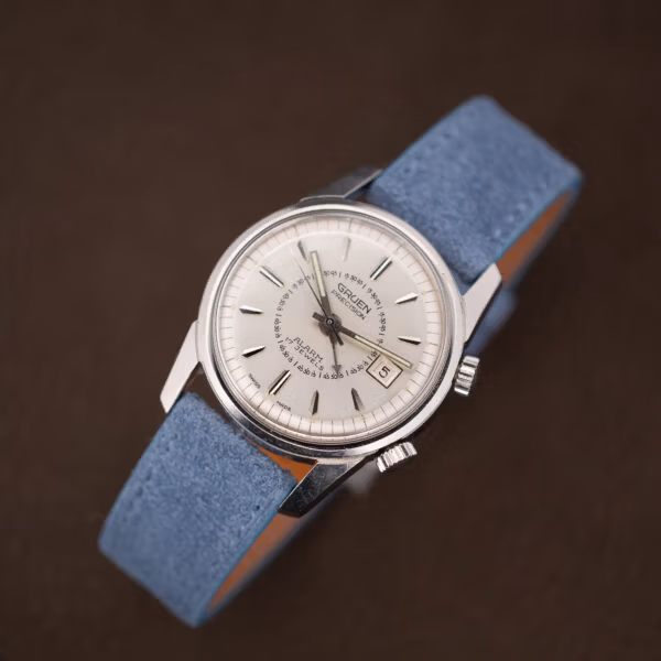 Gruen Precision Alarm silver dial with a small chip at the crystal edge near four to five o'clock