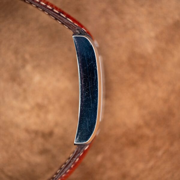 Side profile of the Hampton MV045120 case showing polished flank with honest fine scratching from wear
