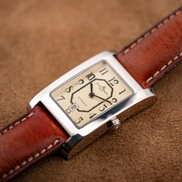 Angled view of the Baume Mercier Hampton MV045120 rectangular steel case and off-white Art Deco dial