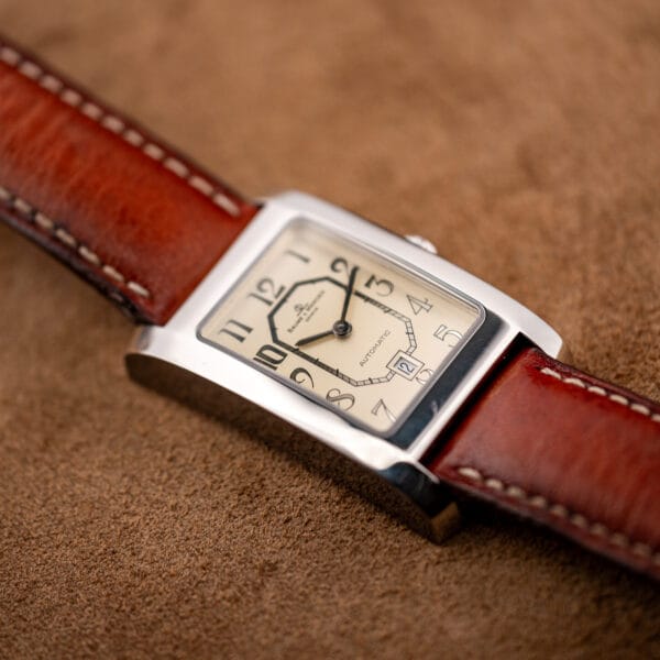 Close angled view of Hampton MV045120 dial with framed date aperture replacing the six numeral