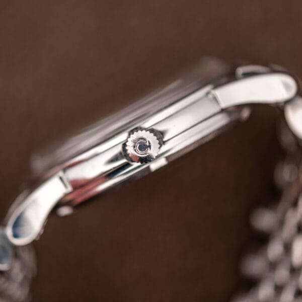 Side profile of the polished Omega Constellation 14393 stainless steel case with the crown at three