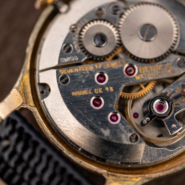 Macro of the Benrus CE-13 manual wind movement with jewelled bridges, index regulator scale and SWISS marking
