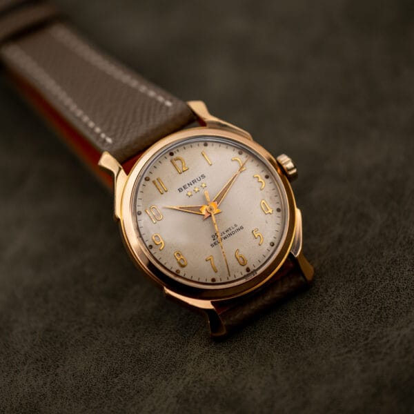 Dial detail on the Benrus 7155 showing star motifs, gold Arabic numerals and dark-centered hands