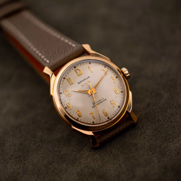 Dial detail on the Benrus 7155 showing star motifs, gold Arabic numerals and dark-centered hands