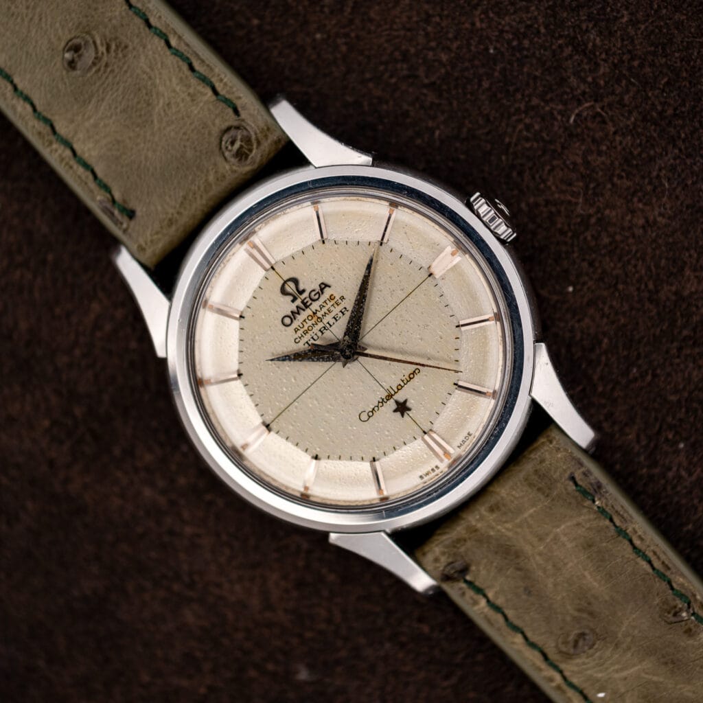 Omega Constellation 14381-7 pie-pan dial with Türler retailer signature, front view on olive ostrich strap