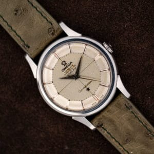 Omega Constellation 14381-7 pie-pan dial with Türler retailer signature, front view on olive ostrich strap