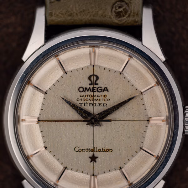 Omega Constellation 14381 dial macro showing the Türler signature, applied markers and heavy age speckling