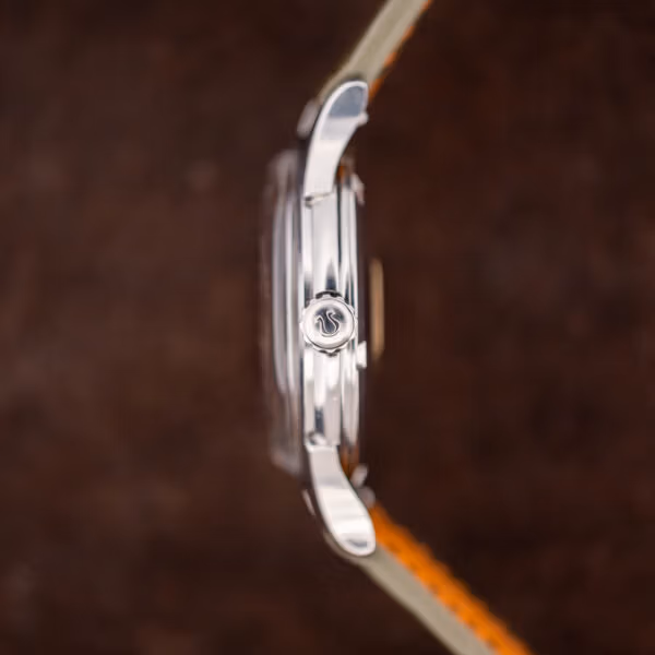 Omega Constellation 14381-7 side profile showing the raised logo motif crown and polished stainless steel case