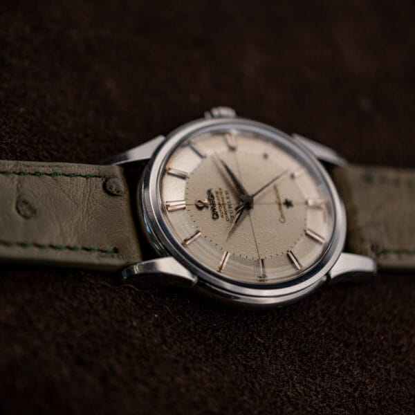Vintage Omega Constellation 14381 crosshair pie-pan dial with applied markers and darkened dauphine hands