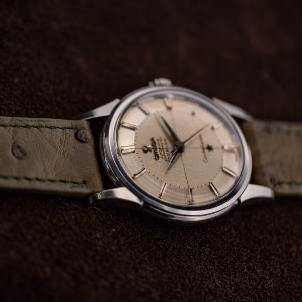 Vintage Omega Constellation 14381 crosshair pie-pan dial with applied markers and darkened dauphine hands