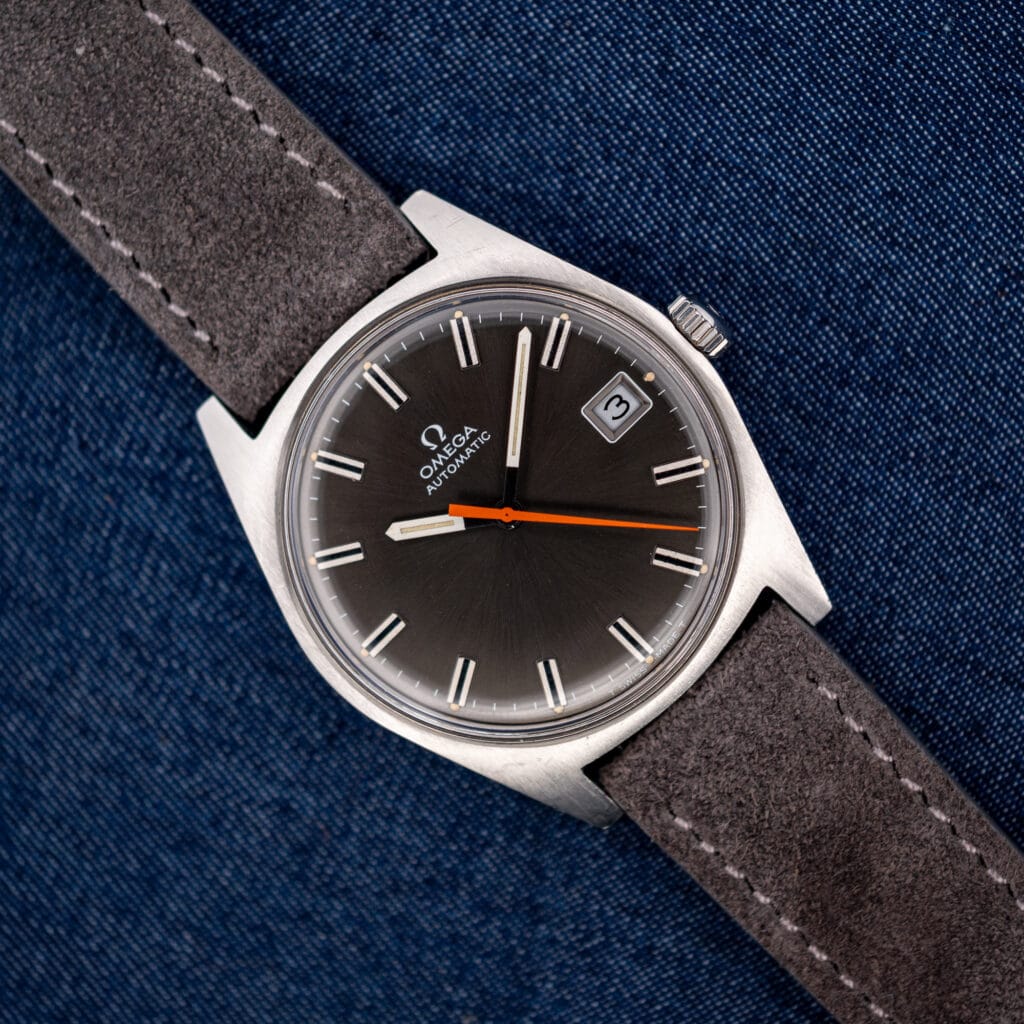 Vintage Omega Geneve 166.041 anthracite dial with orange seconds hand on anthracite suede strap