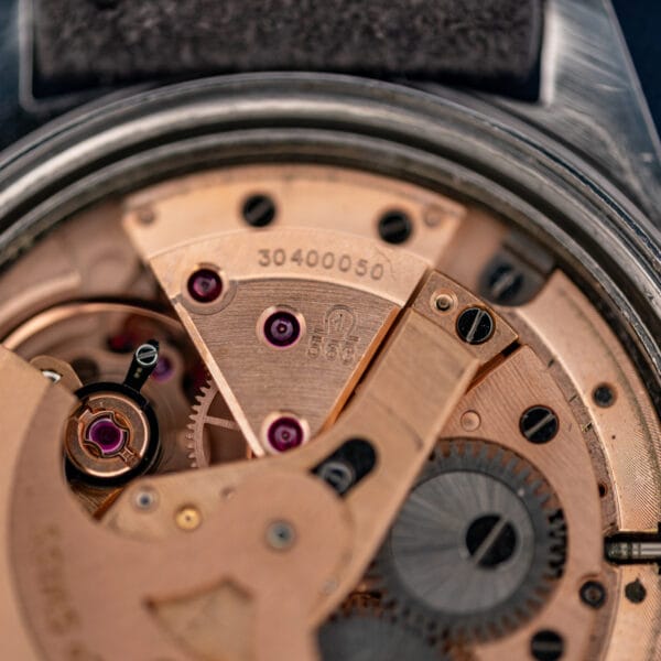 Omega caliber 563 movement bridge stamped 563 with serial number 30400050 and jeweled train visible