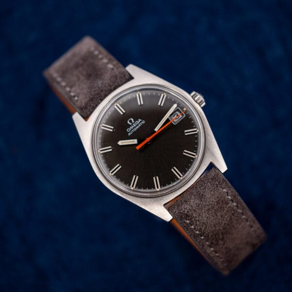 Vintage Omega Geneve 166.041 automatic, applied markers and orange seconds hand under a clear domed crystal