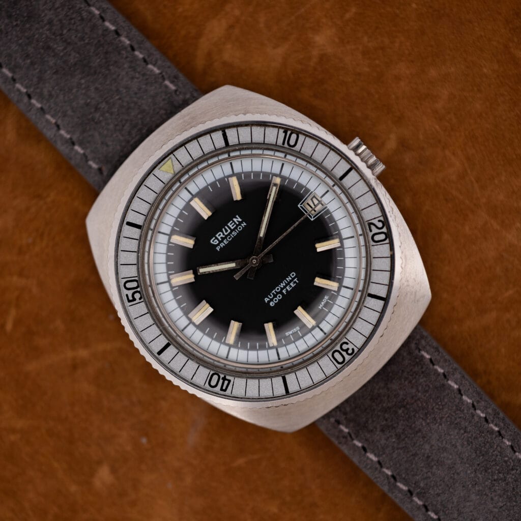 Gruen Precision Autowind 600 Feet black dial with silver bezel and date, on anthracite suede strap