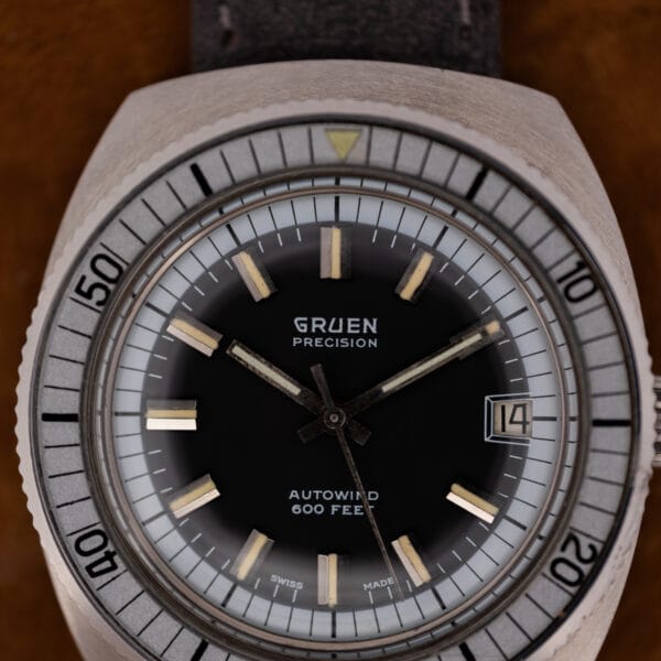 Gruen Autowind 600 Feet dial macro showing applied markers with aged cream lume and crisp white printing