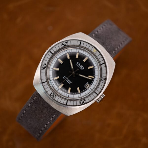 Gruen Precision Autowind black dial and depth rating with light crystal haze and brushed case wear