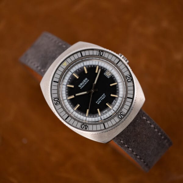 Vintage Gruen Autowind dial showing tritium origin line, applied batons, and broad hands with cream lume