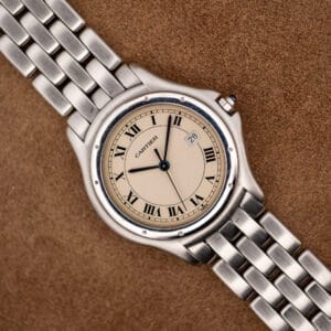 Cartier Cougar 987904 front view, eggshell Roman numeral dial with date at three on steel bracelet