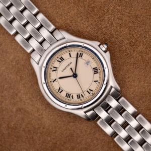 Cartier Cougar 987904 front view, eggshell Roman numeral dial with date at three on steel bracelet