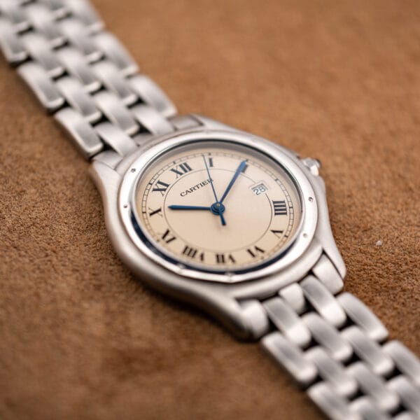 Cartier Cougar 987904 at an angle showing the screws set into its round steel bezel