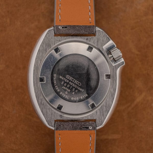 Seiko caseback engraved 6105-8119 with serial 560156, STAINLESS STEEL and WATER RESISTANT, heavily scratched